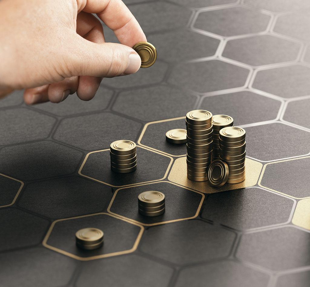 Image of human hand stacking generic coins over a black background with hexagonal golden shapes. Concept of investment management and portfolio diversification.