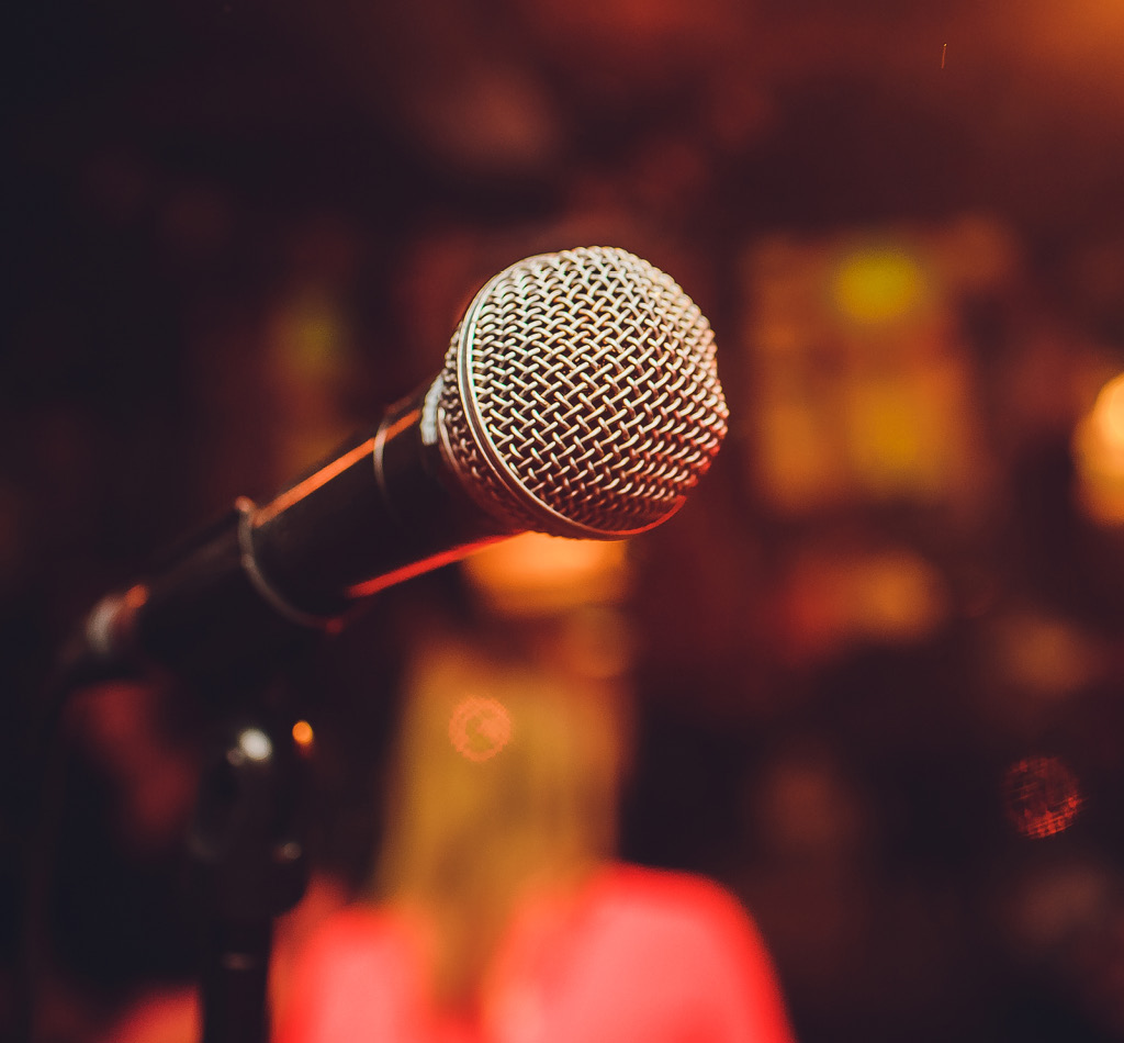 Microphone on stage in an auditorium.