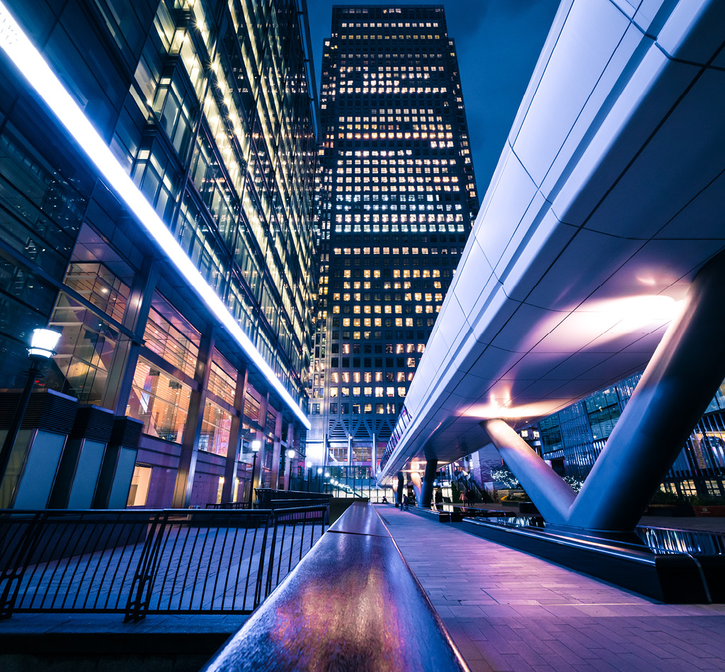 Luminated office buildings at Canary Wharf, London at night.